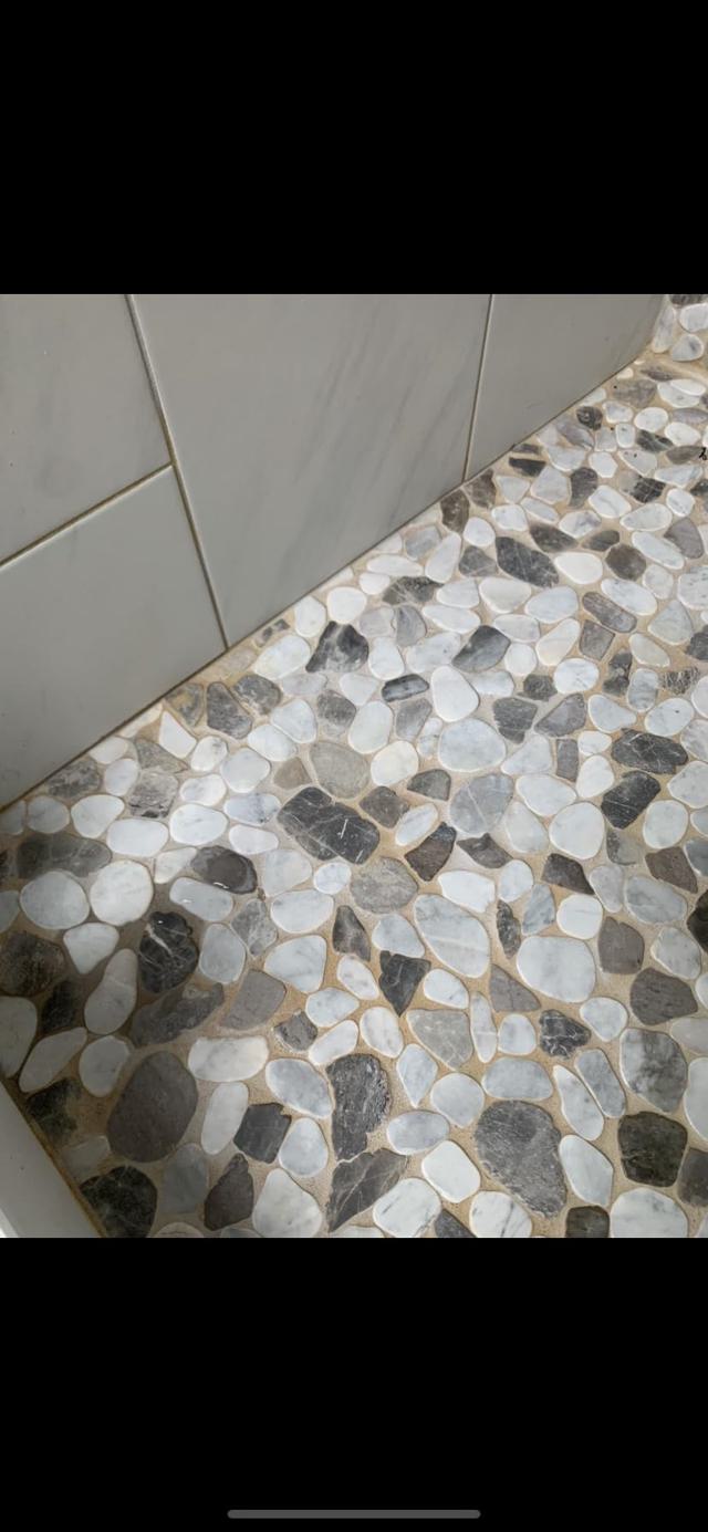 Clean pebble tile shower