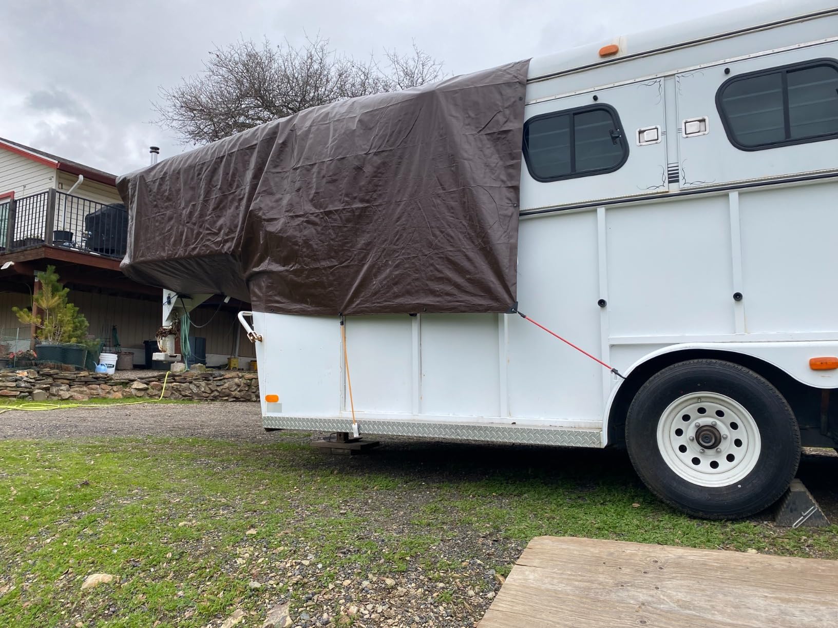 Trailer cover secured with bungee cords